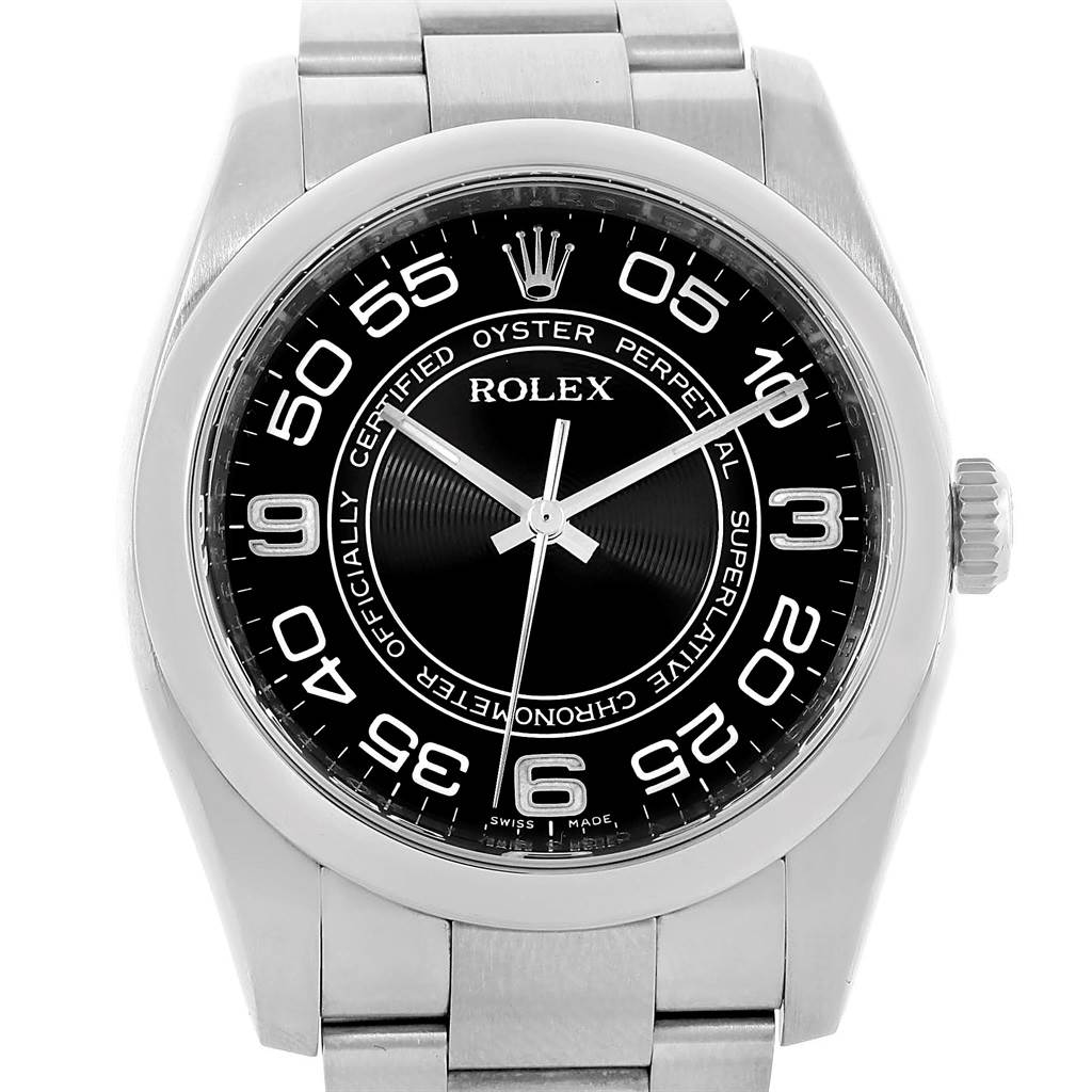 This image shows a front-facing view of a Rolex Oyster Perpetual 116000 Men's Stainless Steel Black Dial 116000 Men's Stainless Steel Black Dial watch, featuring the dial, bezel, case, and part of the bracelet.