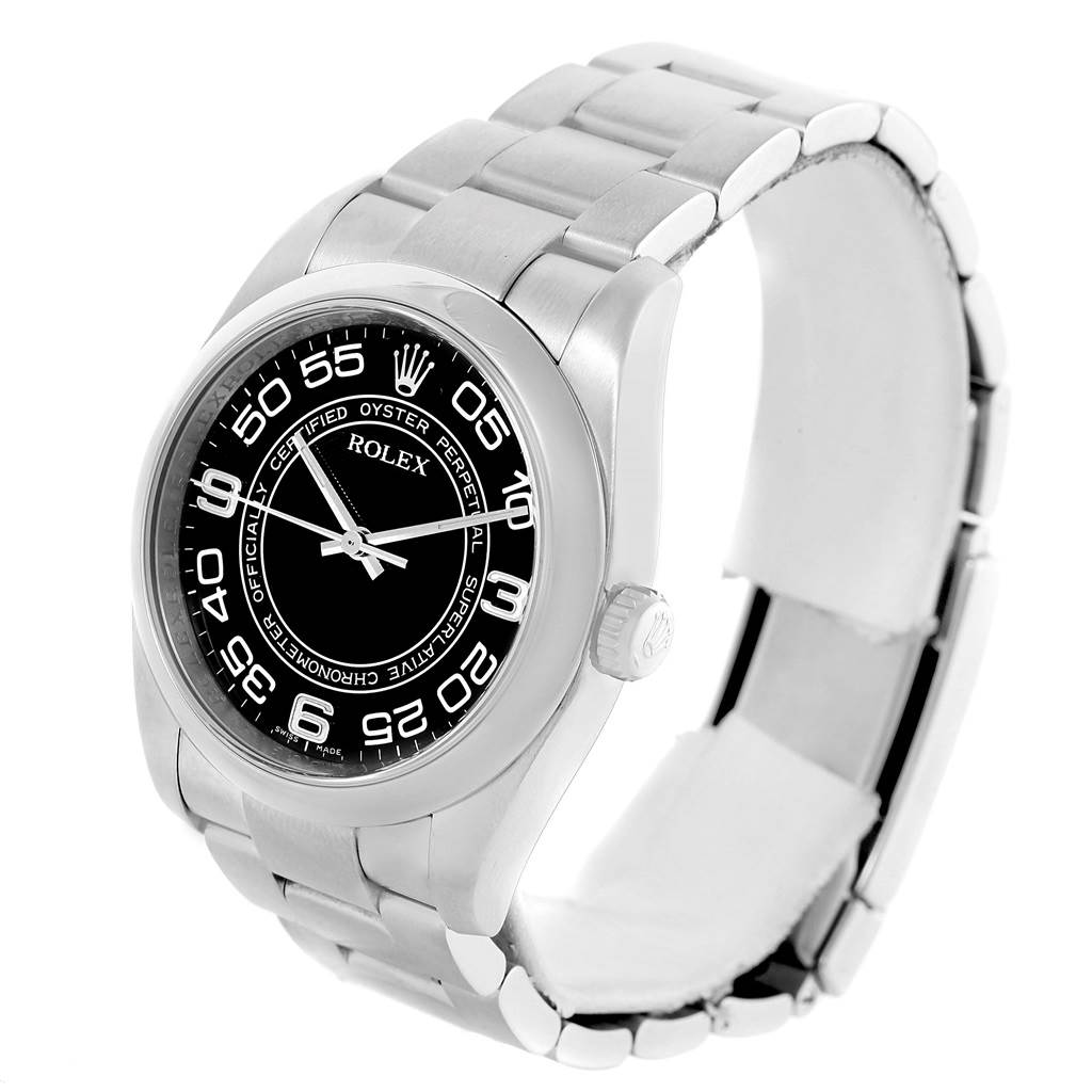 The image shows a Rolex Oyster Perpetual 116000 Men's Stainless Steel Black Dial 116000 Men's Stainless Steel Black Dial watch from a three-quarter angle, highlighting the dial, bezel, and part of the bracelet.