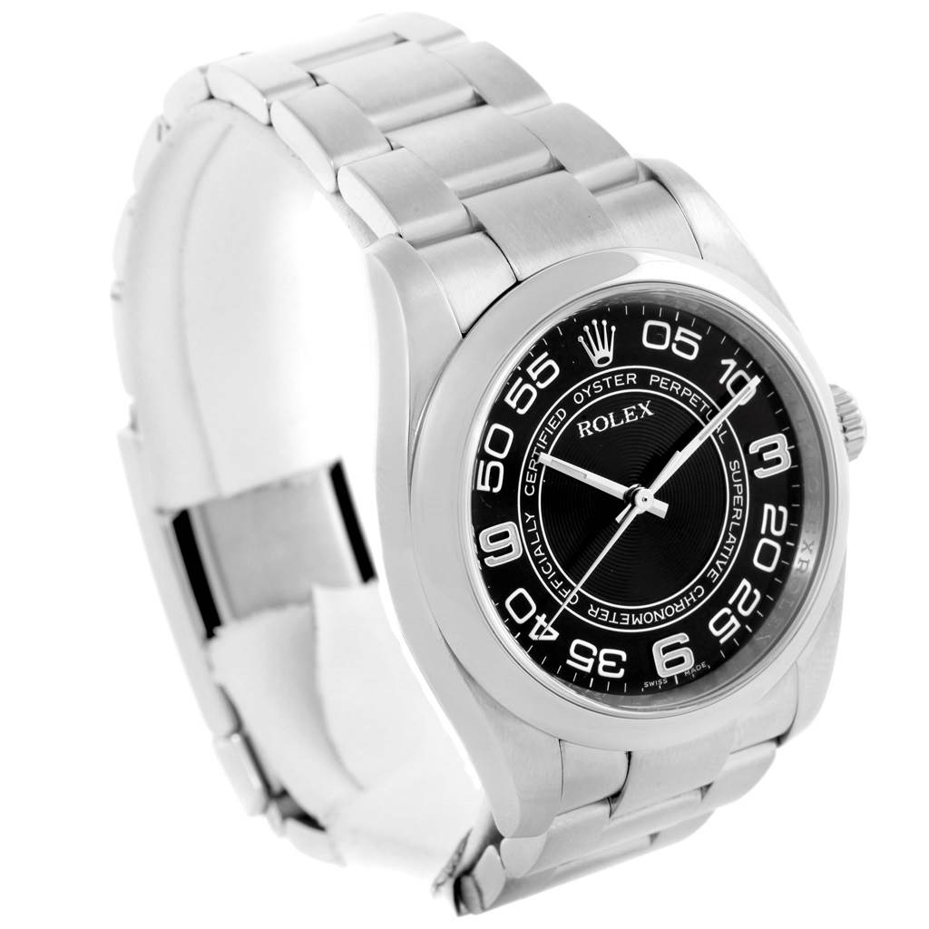 The image shows a Rolex Oyster Perpetual 116000 Men's Stainless Steel Black Dial 116000 Men's Stainless Steel Black Dial watch at a slight angle highlighting its face, crown, and metal bracelet.