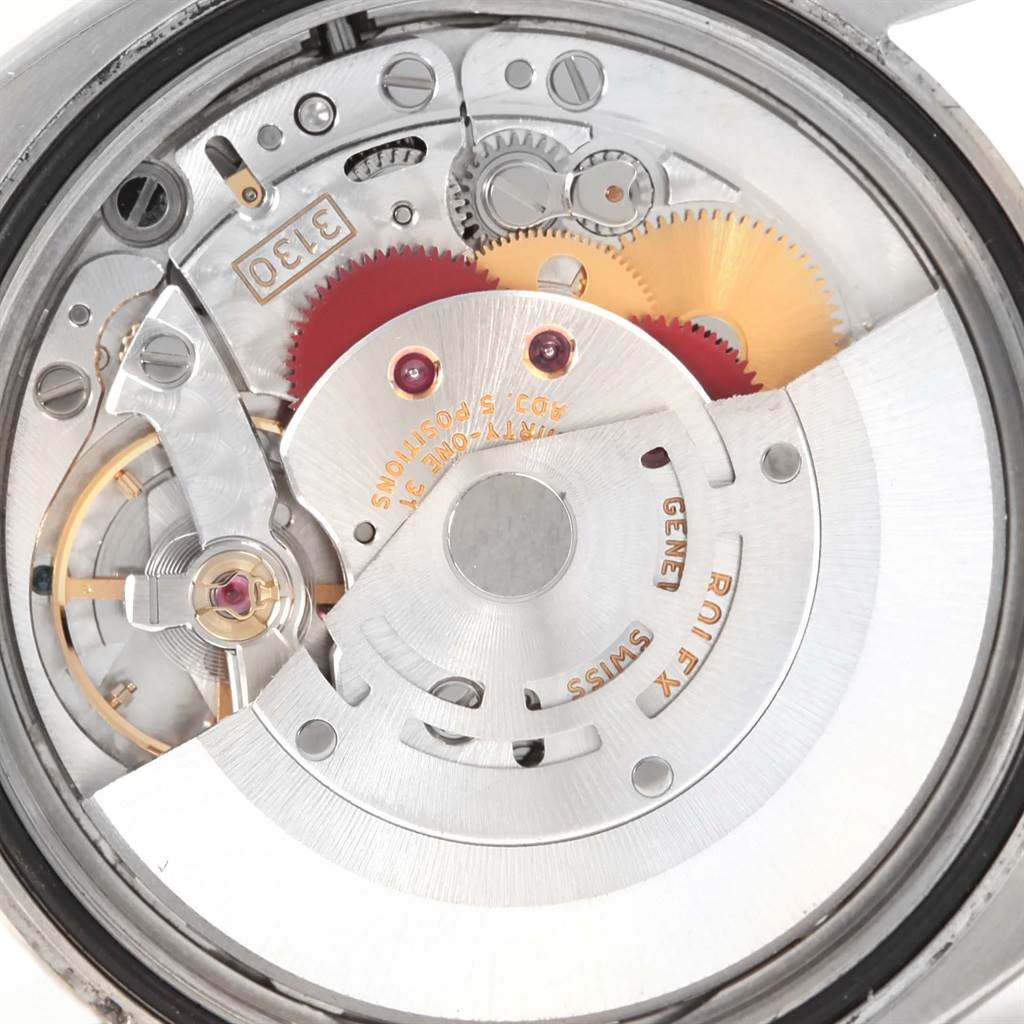 This image shows the internal mechanical movement of a Rolex Oyster Perpetual 116000 Men's Stainless Steel Silver Dial 116000 Men's Stainless Steel Silver Dial watch viewed from the back.