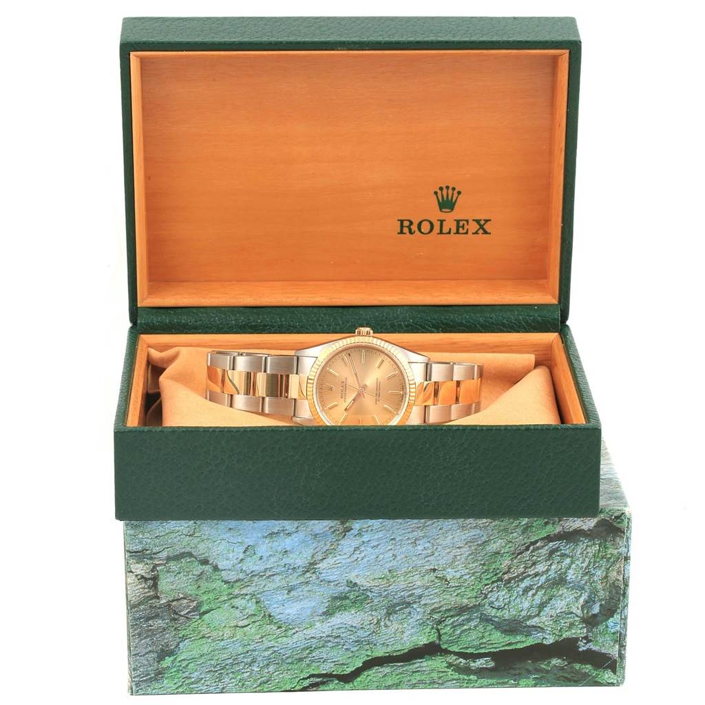 The image shows a Rolex Oyster Perpetual 14233 Men's Steel and Gold (two tone) Champagne Dial 14233 Men's Steel and Gold (two tone) Champagne Dial watch displayed in its open green and wood box, viewed from the front.
