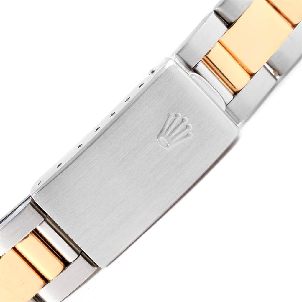 This image shows a close-up view of the clasp and bracelet of a Rolex Oyster Perpetual 14233 Men's Steel and Gold (two tone) Champagne Dial 14233 Men's Steel and Gold (two tone) Champagne Dial watch.