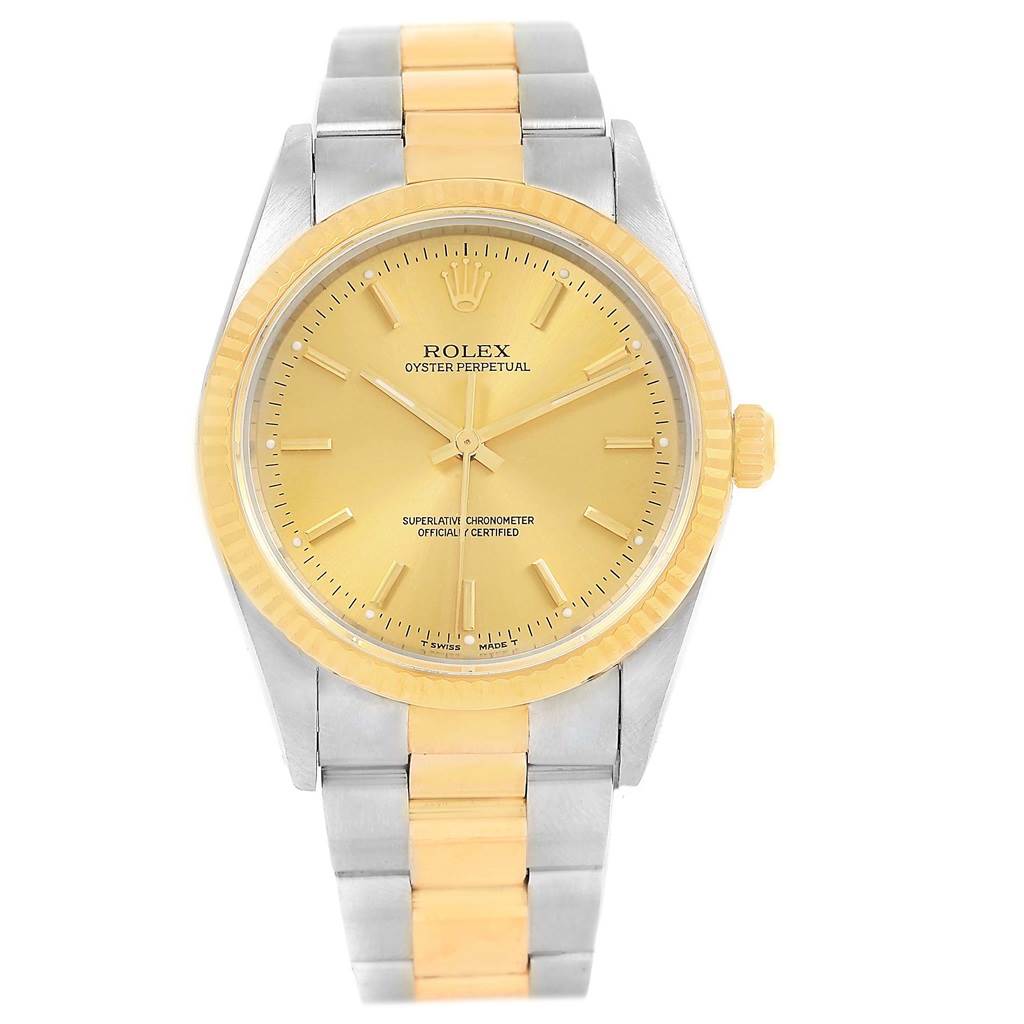 The image shows a front view of a Rolex Oyster Perpetual 14233 Men's Steel and Gold (two tone) Champagne Dial 14233 Men's Steel and Gold (two tone) Champagne Dial watch, featuring a gold dial, gold bezel, and a two-tone bracelet.
