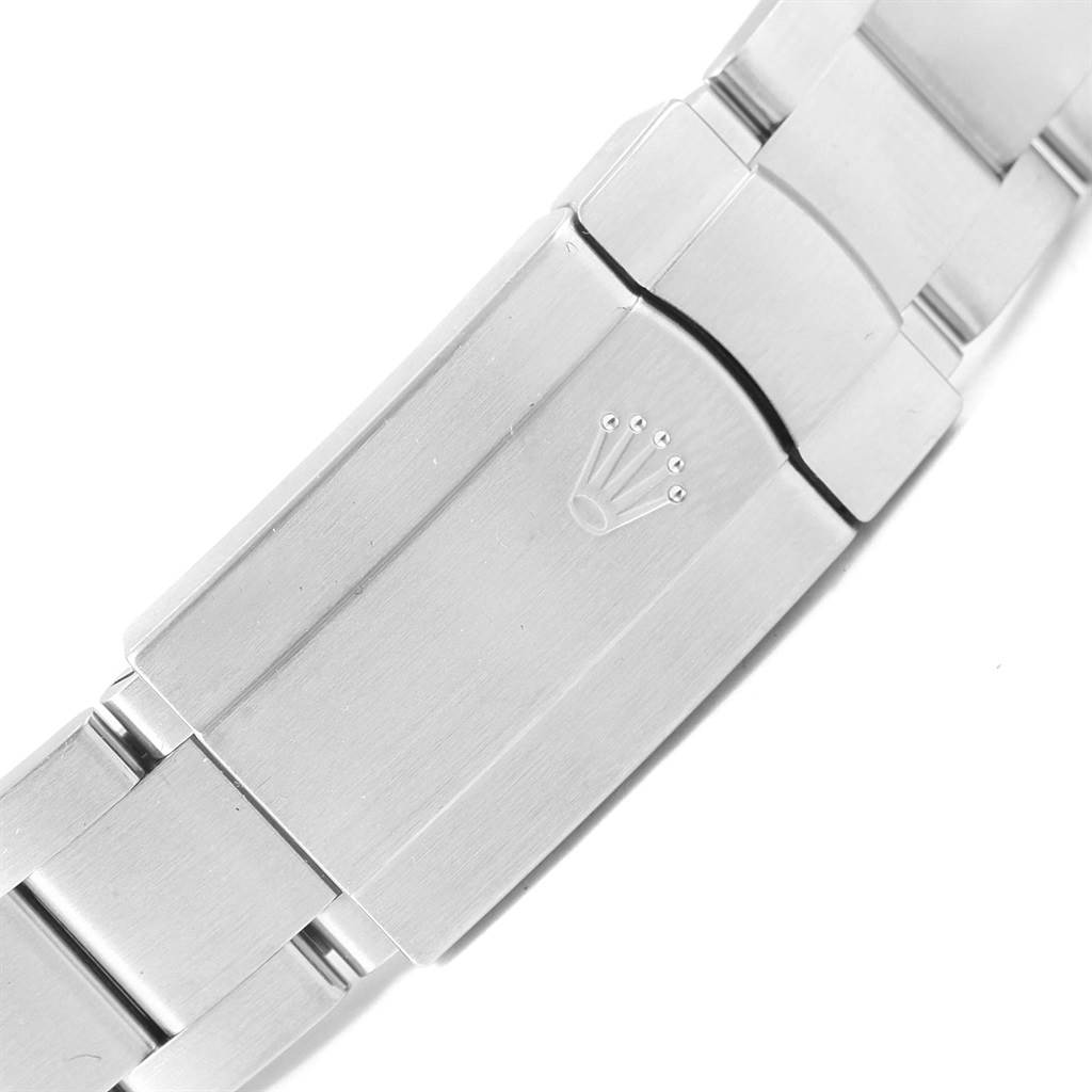 This image shows a close-up of the clasp with the Rolex logo on an Oyster Perpetual model by Rolex.
