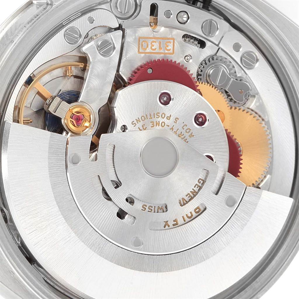 This image shows a high-angle view of the movement mechanism inside a Rolex Oyster Perpetual 114200 Stainless Steel Champagne Dial 114200 Stainless Steel Champagne Dial watch.
