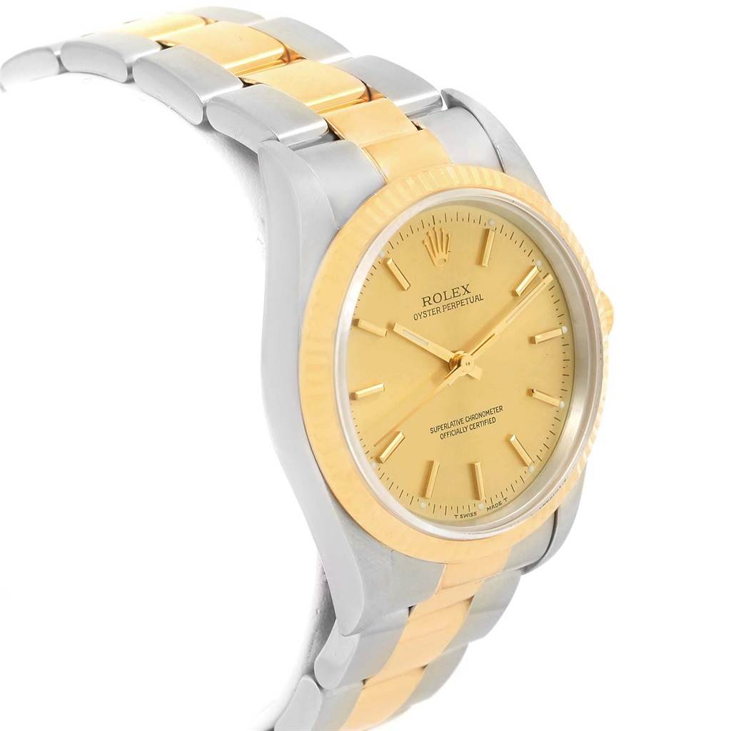 Side angle view of a Rolex Oyster Perpetual 14233 Men's Steel and Gold (two tone) Champagne Dial 14233 Men's Steel and Gold (two tone) Champagne Dial watch showing the dial, bezel, and two-tone bracelet.