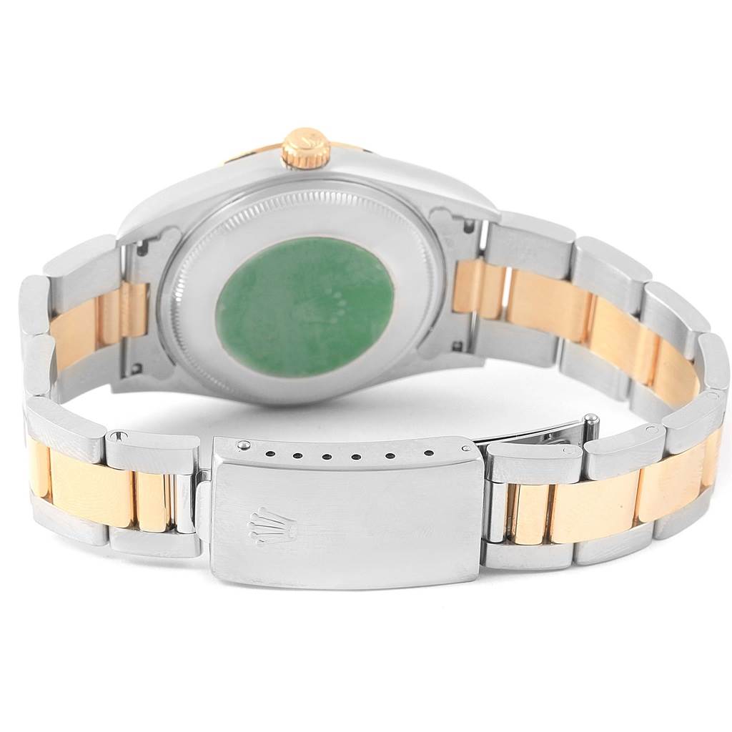 This image shows the back view of a Rolex Oyster Perpetual 14233 Men's Steel and Gold (two tone) Champagne Dial 14233 Men's Steel and Gold (two tone) Champagne Dial watch, highlighting the bracelet and clasp.