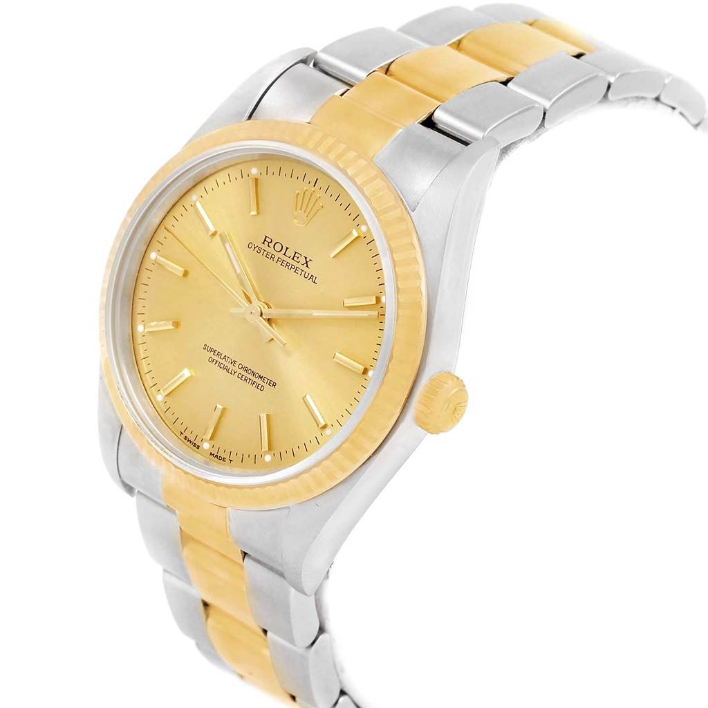 The image shows a Rolex Oyster Perpetual 14233 Men's Steel and Gold (two tone) Champagne Dial 14233 Men's Steel and Gold (two tone) Champagne Dial watch angled to display the face, crown, and bracelet.