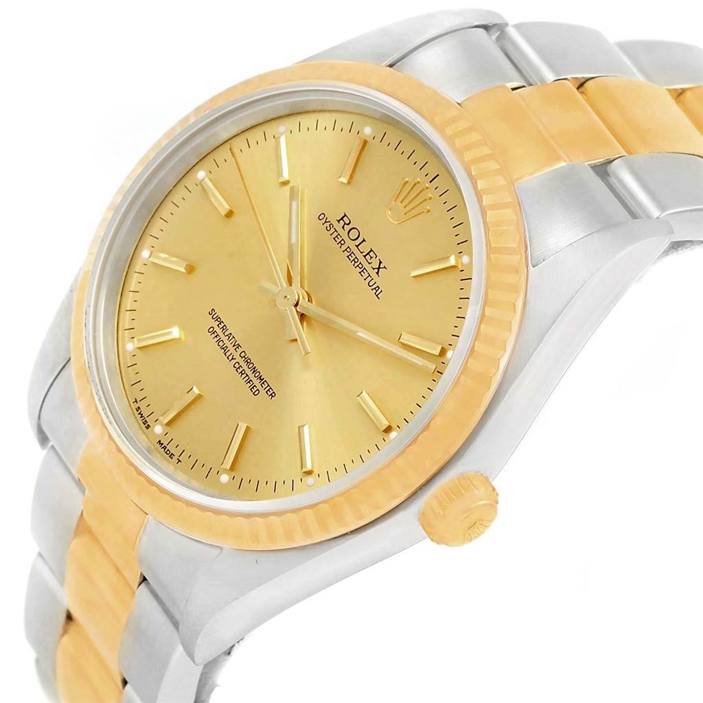 This Oyster Perpetual Rolex watch is shown from a three-quarter angle, highlighting the dial, crown, and part of the bracelet.