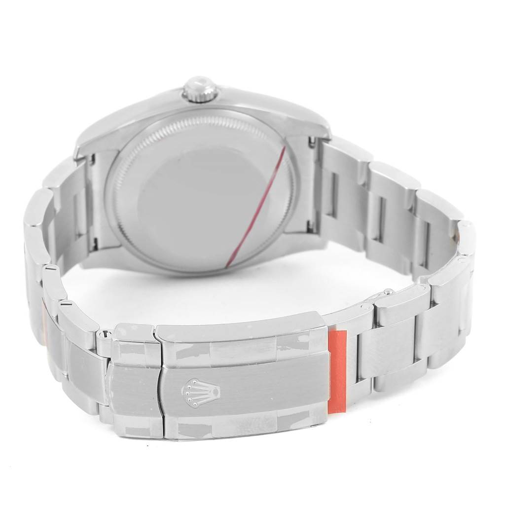 The image shows the Rolex Oyster Perpetual 116000 Stainless Steel Champagne Dial 116000 Stainless Steel Champagne Dial watch from the rear, highlighting its stainless steel bracelet and closed clasp.