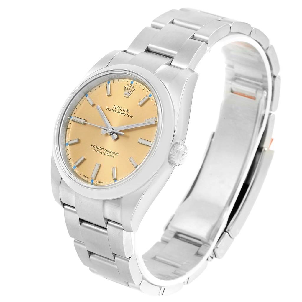 The Rolex Oyster Perpetual 116000 Stainless Steel Champagne Dial 116000 Stainless Steel Champagne Dial watch is shown at a slight angle, highlighting its face, bezel, crown, and bracelet.