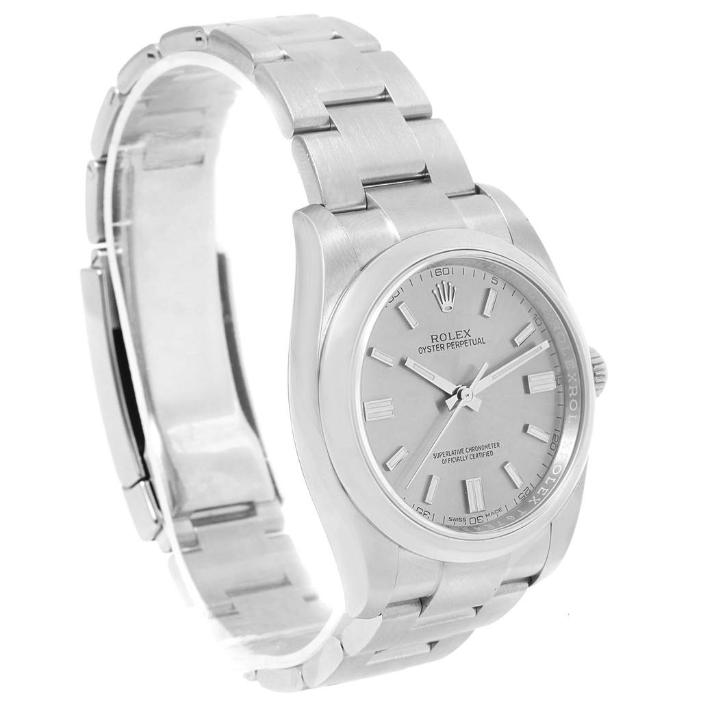 The image shows a side-angle view of a Rolex Oyster Perpetual 116000 Stainless Steel Grey Dial 116000 Stainless Steel Grey Dial watch, highlighting the face, bezel, bracelet, and part of the clasp.
