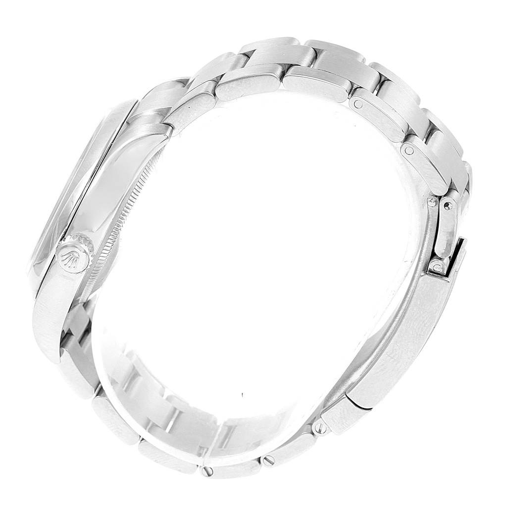 The image shows a side view of the Rolex Oyster Perpetual 116000 Stainless Steel Burgundy Dial 116000 Stainless Steel Burgundy Dial watch, highlighting the bracelet, clasp, and crown.