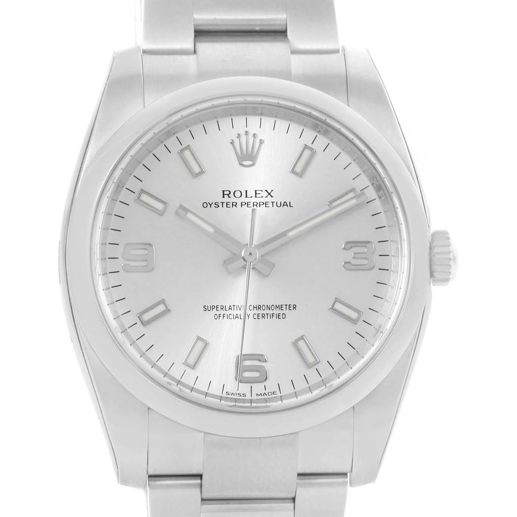 The image displays a front view of the Rolex Oyster Perpetual 114200 Men's Stainless Steel Silver Dial 114200 Men's Stainless Steel Silver Dial watch, showing the face, dial, hands, and part of the metal bracelet.
