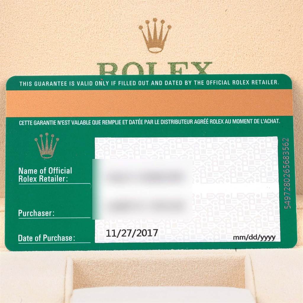This image shows the official warranty card for a Rolex Oyster Perpetual 114200 Men's Stainless Steel Silver Dial 114200 Men's Stainless Steel Silver Dial watch, displaying retailer details and purchase date.