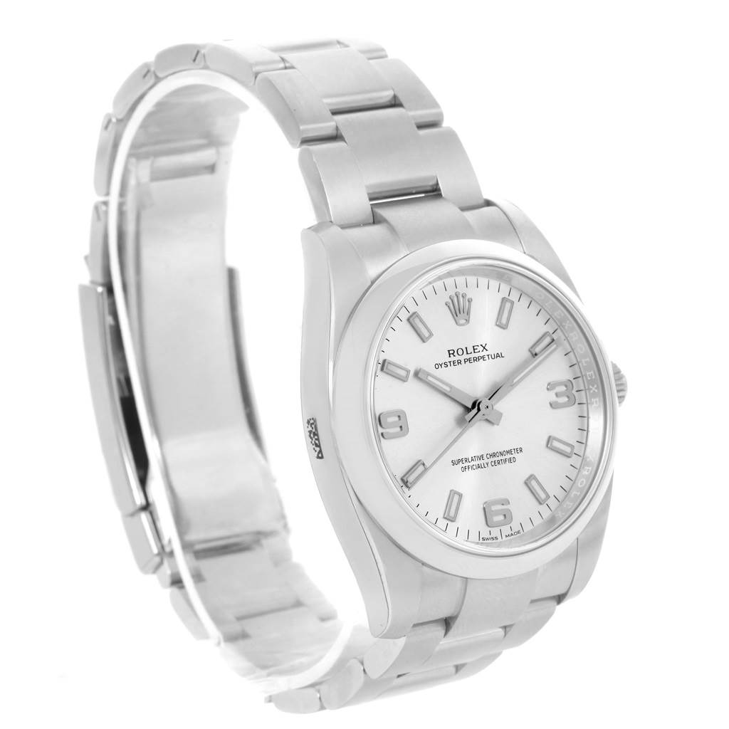This image shows a Rolex Oyster Perpetual 114200 Men's Stainless Steel Silver Dial 114200 Men's Stainless Steel Silver Dial watch at a slight angle, highlighting the face and metal bracelet.