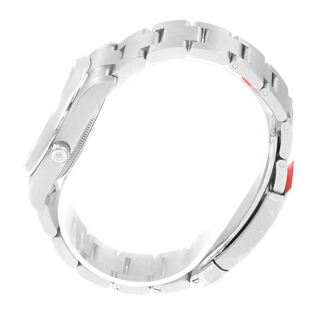 This side angle shows the bracelet and crown of the Rolex Oyster Perpetual 114200 Men's Stainless Steel Silver Dial 114200 Men's Stainless Steel Silver Dial watch.