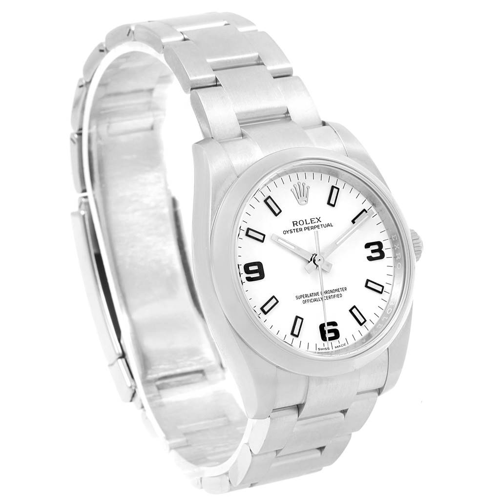 The Rolex Oyster Perpetual 114200 Stainless Steel White Dial 114200 Stainless Steel White Dial watch is shown at an angled side view, highlighting its face, bracelet, and clasp.