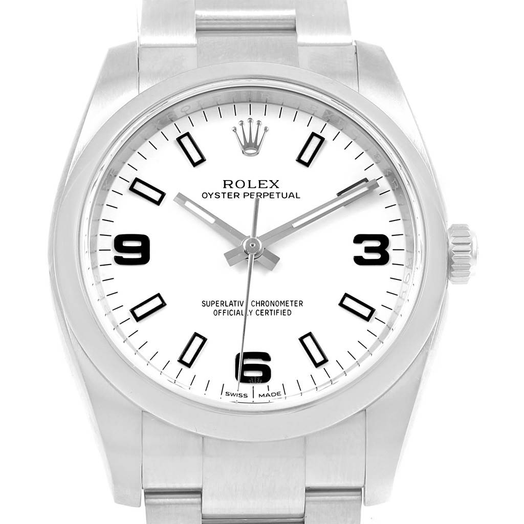 The image shows a front view of a Rolex Oyster Perpetual 114200 Stainless Steel White Dial 114200 Stainless Steel White Dial watch, highlighting the dial, hands, and part of the bracelet.