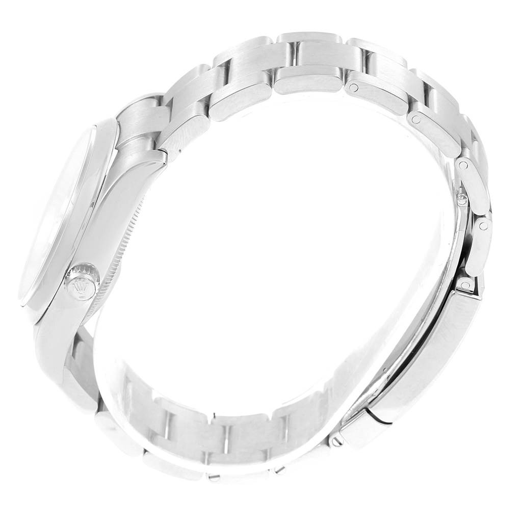 This side profile shows the bracelet and case, including the crown of the Rolex Oyster Perpetual 114200 Stainless Steel White Dial 114200 Stainless Steel White Dial watch.