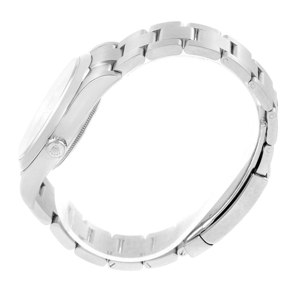 This is a side view of the Rolex Oyster Perpetual 114300 Stainless Steel Burgundy Dial 114300 Stainless Steel Burgundy Dial watch, showing its case, crown, and bracelet.