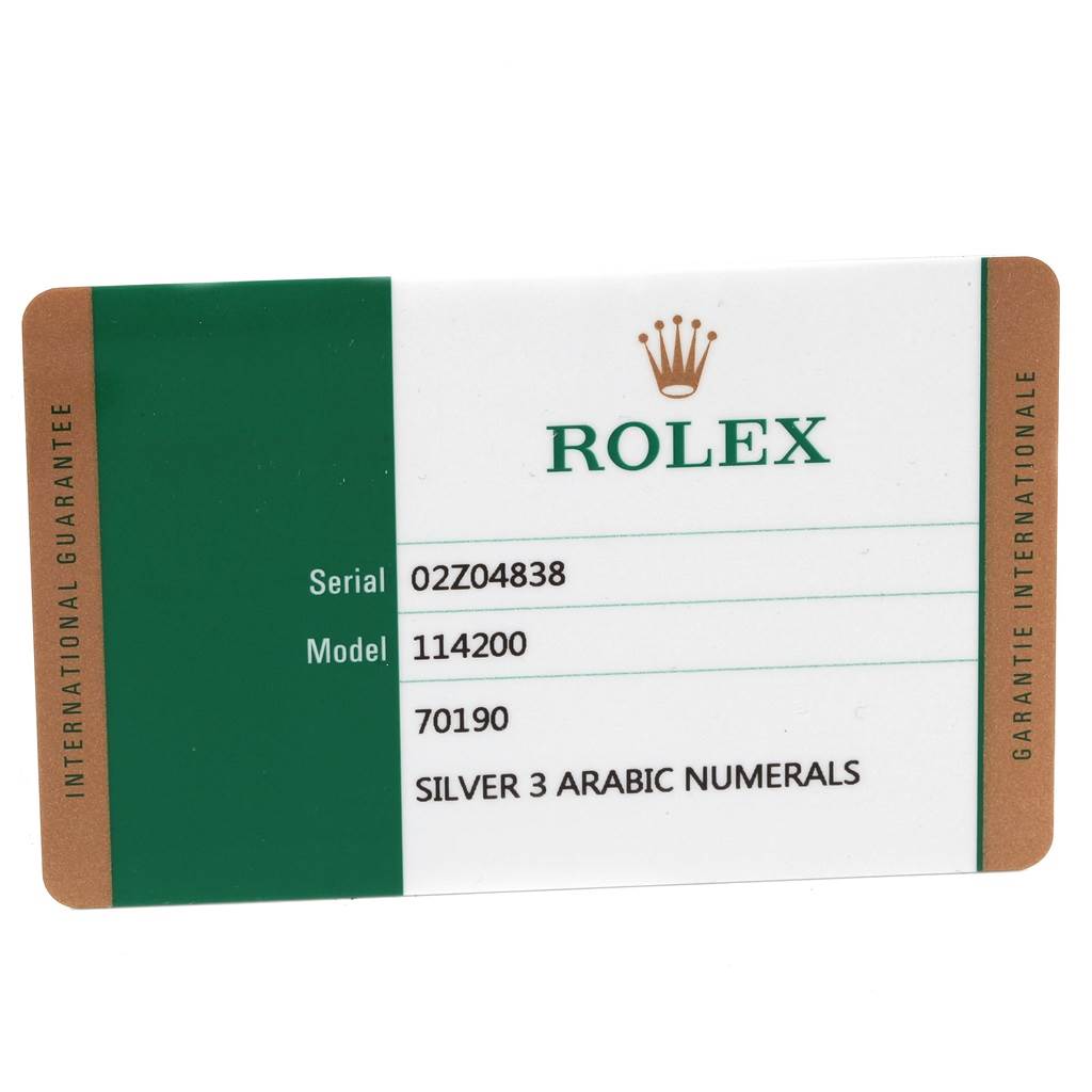 The image shows the international guarantee card for a Rolex Oyster Perpetual 114200 Stainless Steel Silver Dial 114200 Stainless Steel Silver Dial model 114200 watch.