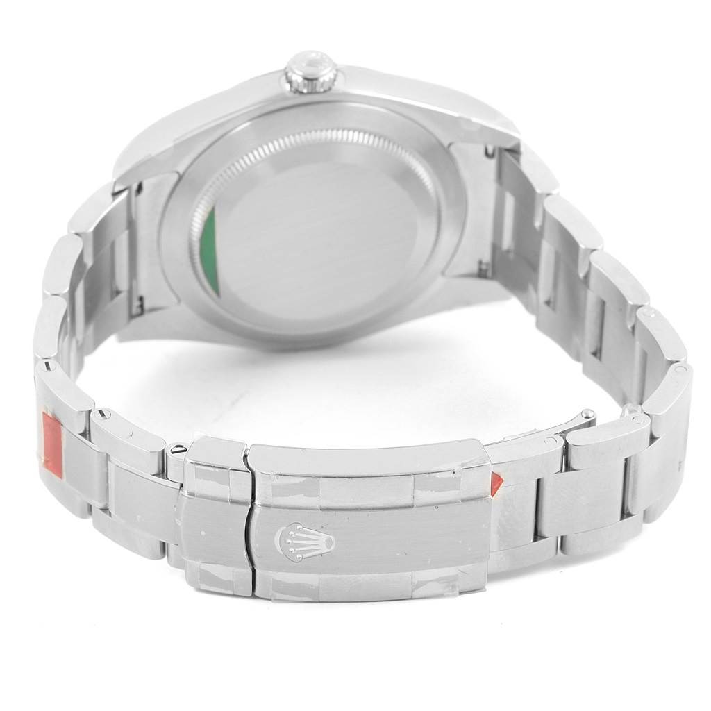 This image shows the back case and bracelet clasp of a Rolex Oyster Perpetual 114300 Stainless Steel Burgundy Dial 114300 Stainless Steel Burgundy Dial watch from a rear angle.