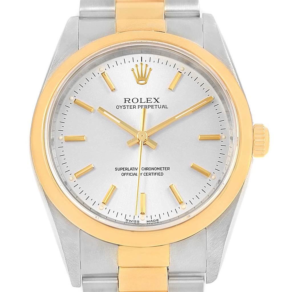 The image shows a frontal view of a Rolex Oyster Perpetual 14203 Steel and Gold (two tone) Silver Dial 14203 Steel and Gold (two tone) Silver Dial watch, highlighting the dial, bezel, crown, and part of the bracelet.