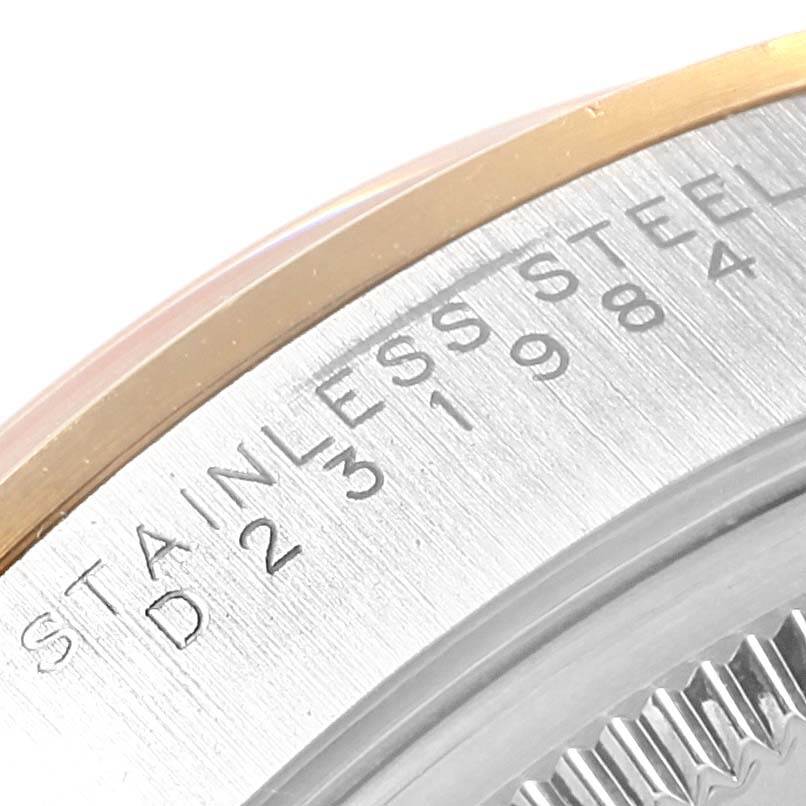The image shows a close-up of the case back and edge engraving of a Rolex Oyster Perpetual 14203 Steel and Gold (two tone) Silver Dial 14203 Steel and Gold (two tone) Silver Dial watch.
