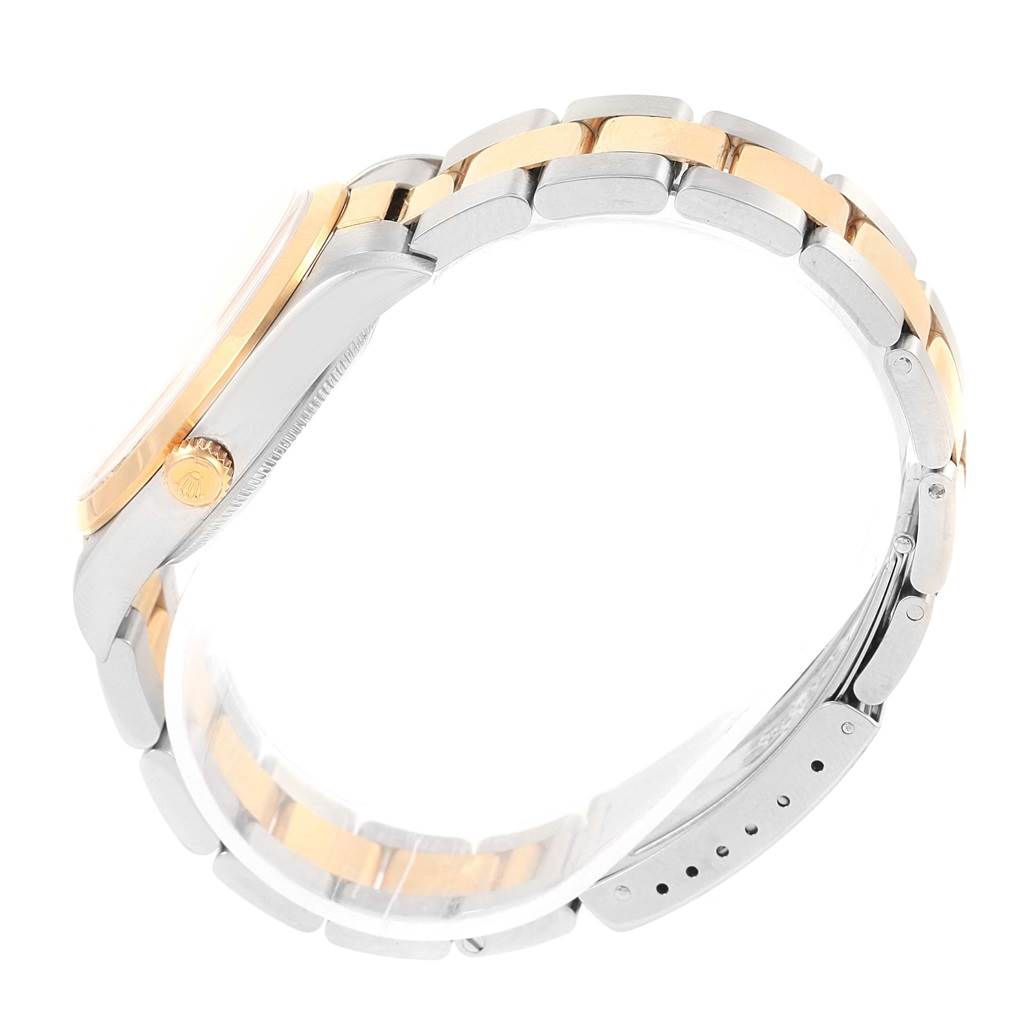 This image shows a side profile of a Rolex Oyster Perpetual 14203 Steel and Gold (two tone) Silver Dial 14203 Steel and Gold (two tone) Silver Dial watch, focusing on the crown, case, and bracelet with clasp.