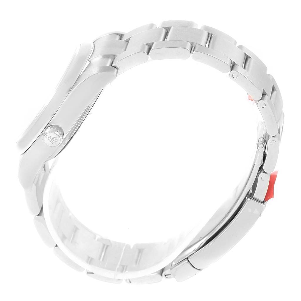 This image shows a side view of the bracelet and case of the Rolex Oyster Perpetual 114200 Men's Stainless Steel Blue Dial 114200 Men's Stainless Steel Blue Dial watch, highlighting the crown and links.