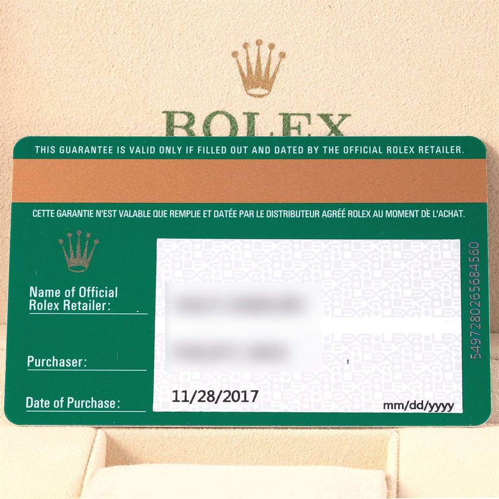 This image shows a warranty card for the Rolex Oyster Perpetual 114200 Men's Stainless Steel Blue Dial 114200 Men's Stainless Steel Blue Dial model.