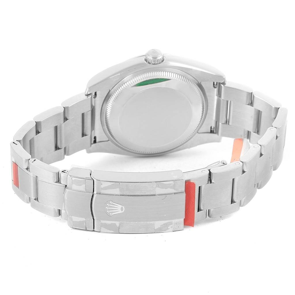 The image shows the back view of the Rolex Oyster Perpetual 114200 Men's Stainless Steel Blue Dial 114200 Men's Stainless Steel Blue Dial watch, focusing on the case back and bracelet.