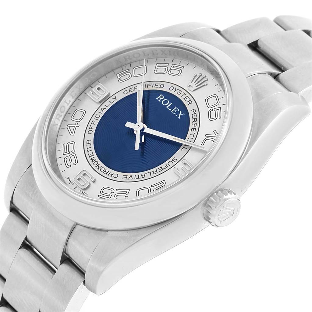 This angled shot of the Rolex Oyster Perpetual 116000 Men's Stainless Steel Silver Dial 116000 Men's Stainless Steel Silver Dial watch shows the face, crown, and part of the bracelet.