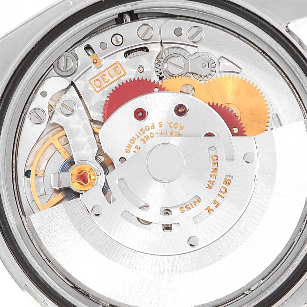 This image shows the intricate internal movement mechanism of a Rolex Oyster Perpetual 116000 Men's Stainless Steel Silver Dial 116000 Men's Stainless Steel Silver Dial watch.