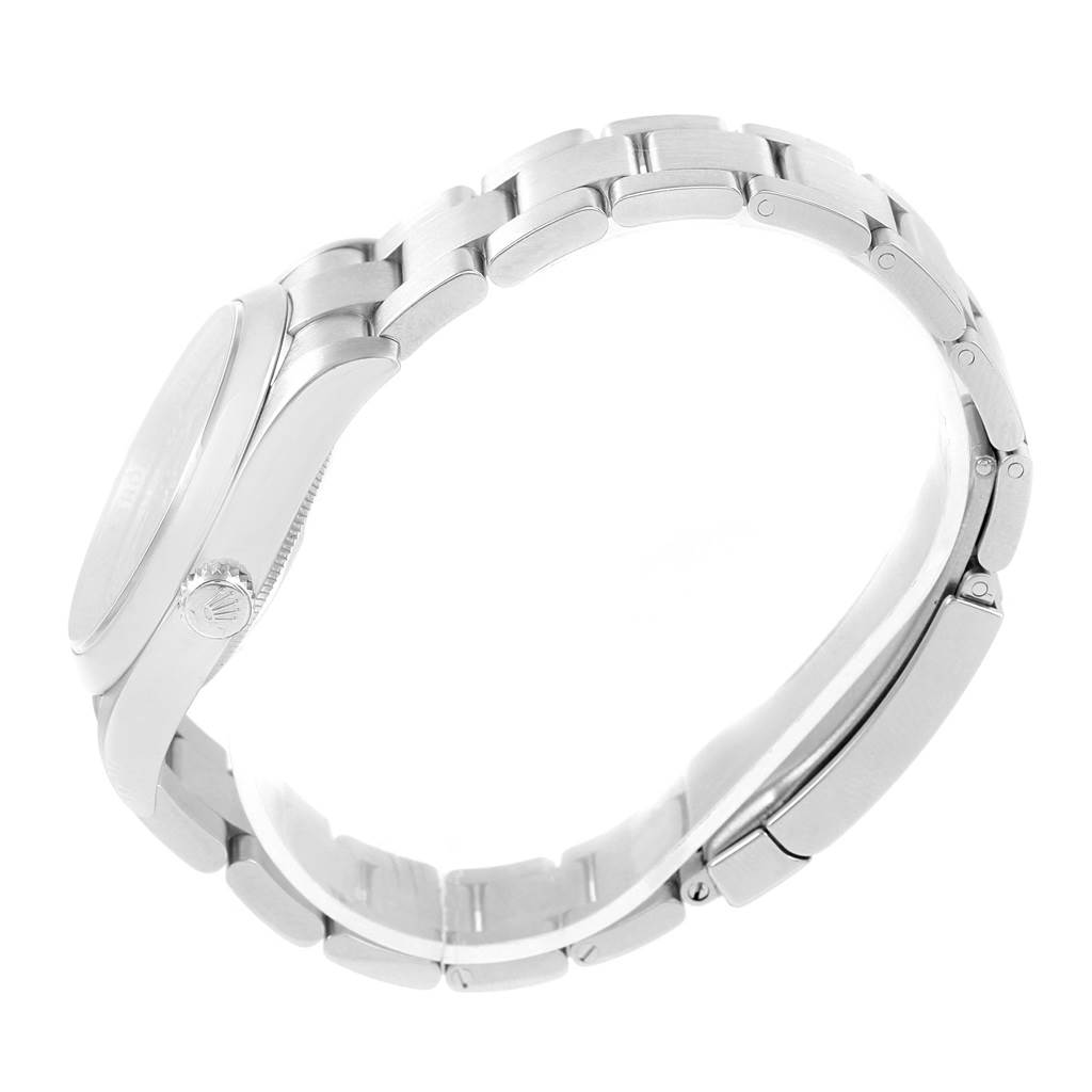 This image shows a side view of the bracelet, crown, and case of a Rolex Oyster Perpetual 116000 Men's Stainless Steel Silver Dial 116000 Men's Stainless Steel Silver Dial watch.