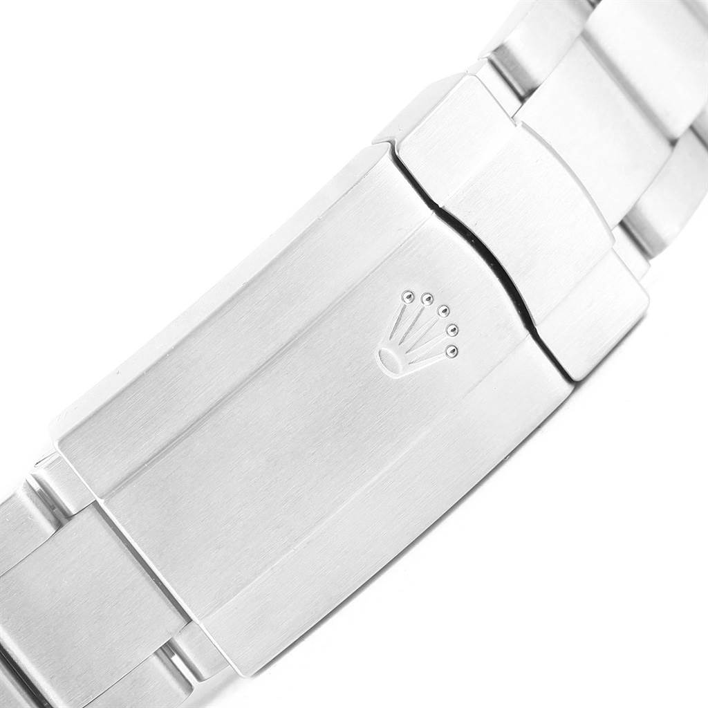 This image shows a close-up of the clasp on the bracelet of a Rolex Oyster Perpetual 116000 Men's Stainless Steel Blue Dial 116000 Men's Stainless Steel Blue Dial watch.