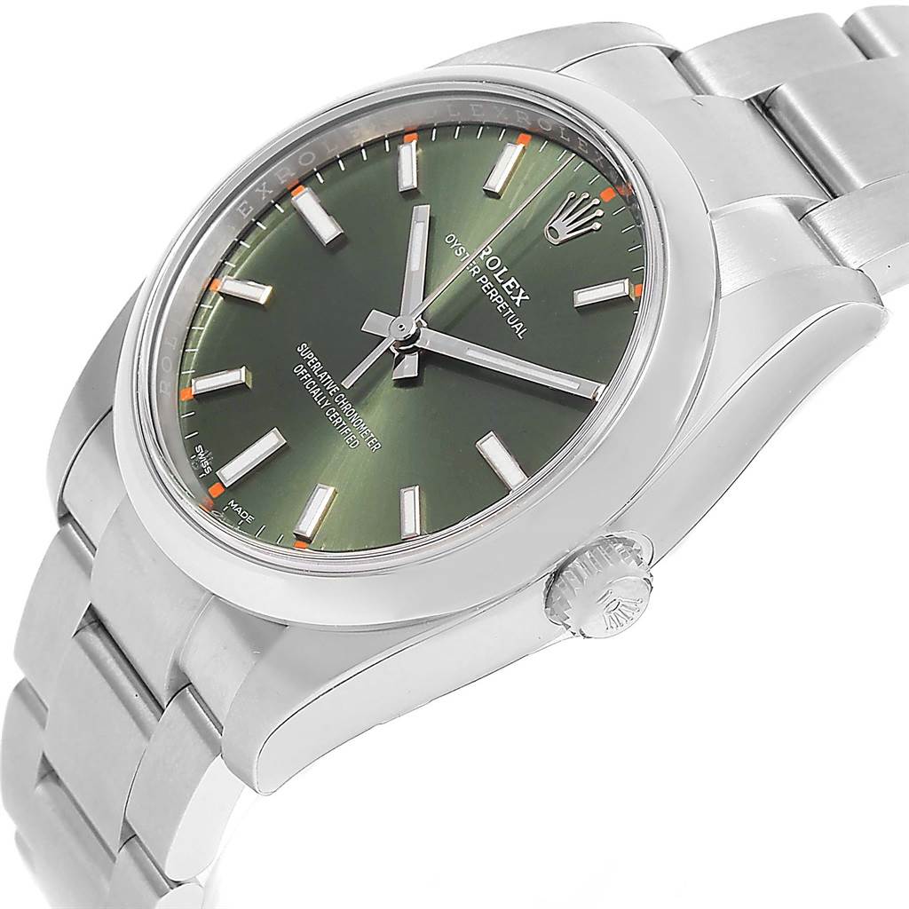 The image shows a Rolex Oyster Perpetual 114200 Stainless Steel Green Dial 114200 Stainless Steel Green Dial watch at a slight angle, highlighting the crown, dial, bezel, and part of the bracelet.