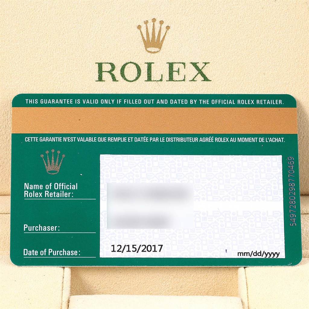 The image shows a warranty card for the Rolex Oyster Perpetual 114200 Stainless Steel Green Dial 114200 Stainless Steel Green Dial watch model, featuring purchase details and retailer information.