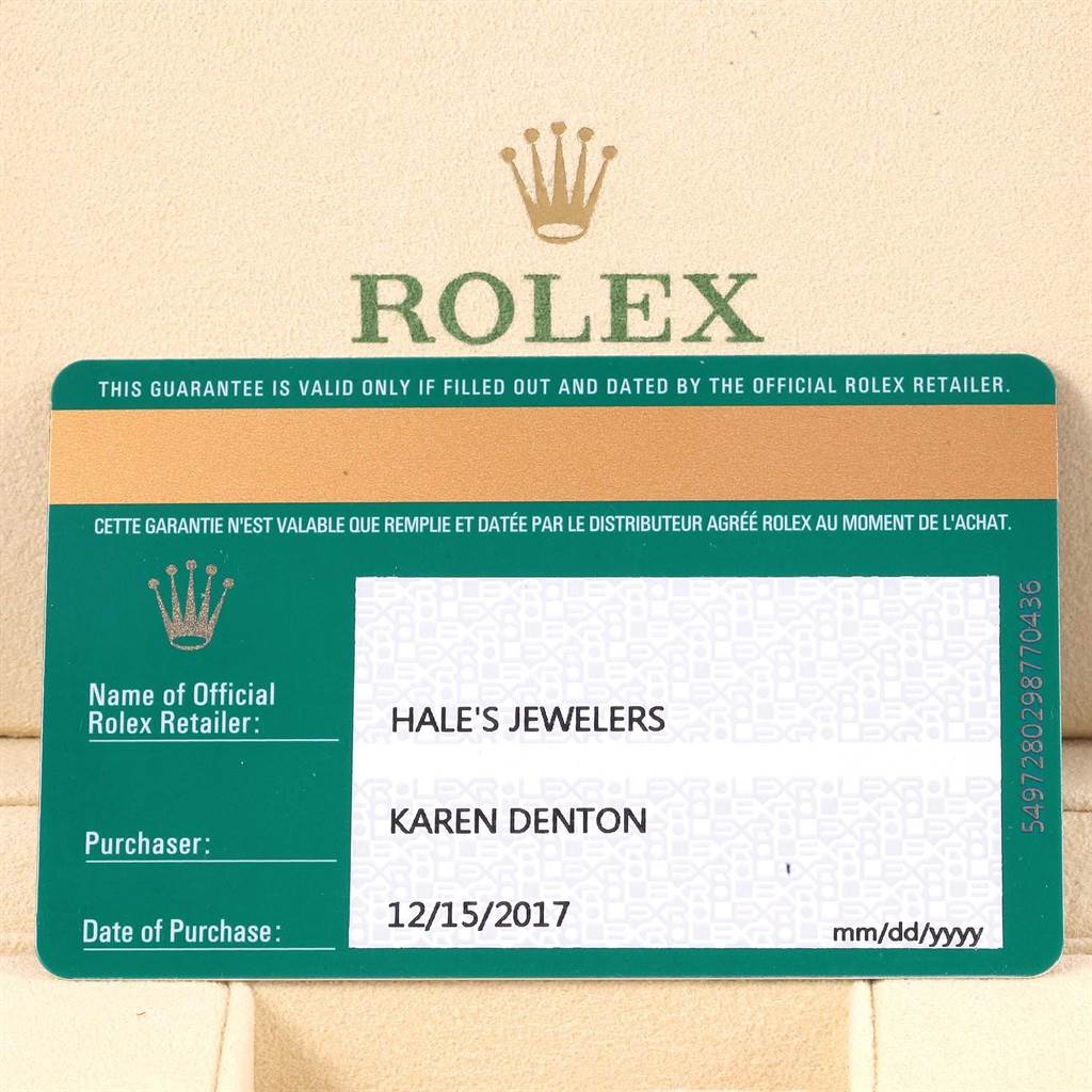 This image shows a warranty card for the Rolex Oyster Perpetual 114200 Green Dial 114200 Green Dial model, including details like seller, purchaser, and purchase date.