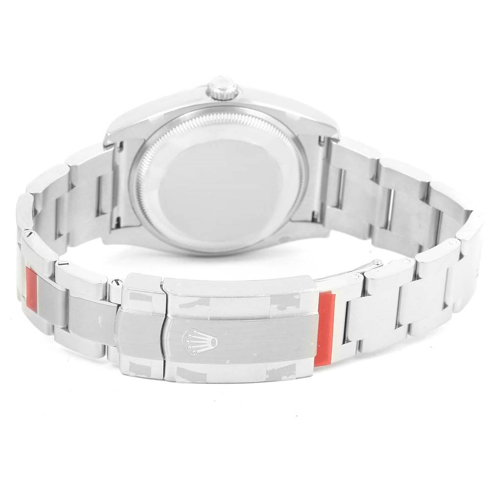 The image shows the back case and clasp of a Rolex Oyster Perpetual 114200 Stainless Steel Green Dial 114200 Stainless Steel Green Dial watch.