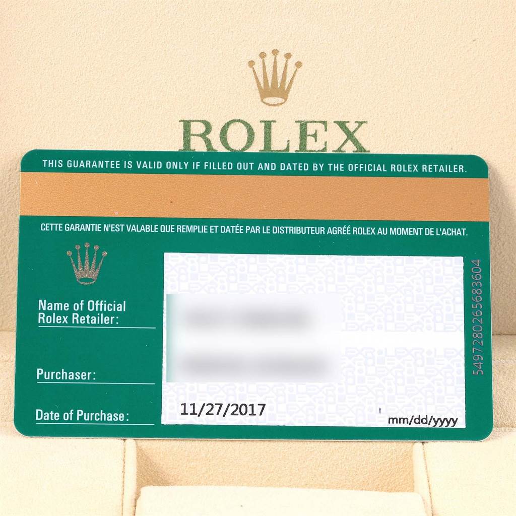 This image shows the official warranty card for a Rolex Oyster Perpetual 114200 Men's Stainless Steel Blue Dial 114200 Men's Stainless Steel Blue Dial watch, including purchase details.