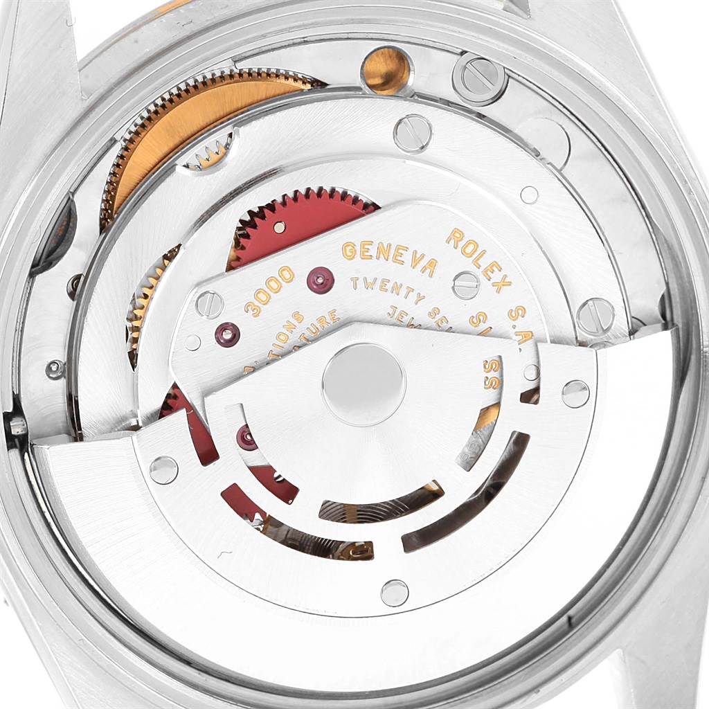 This image shows the movement and internal components of a Rolex Oyster Perpetual 14233 Men's Steel and Gold (two tone) White Dial 14233 Men's Steel and Gold (two tone) White Dial watch from a rear angle.