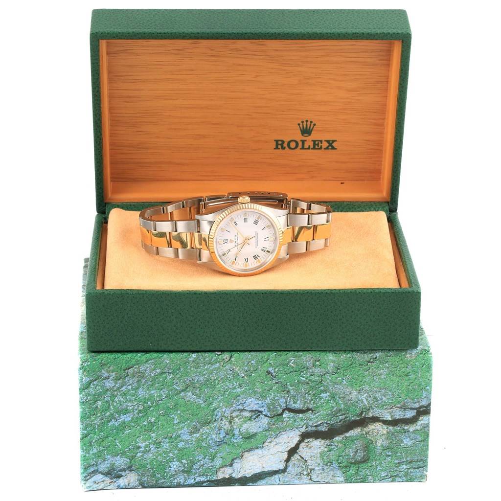 The Rolex Oyster Perpetual 14233 Men's Steel and Gold (two tone) White Dial 14233 Men's Steel and Gold (two tone) White Dial watch is displayed front-facing in its open green and wood box.