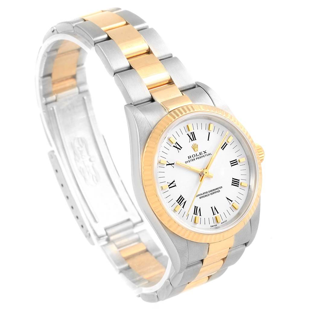 The Rolex Oyster Perpetual 14233 Men's Steel and Gold (two tone) White Dial 14233 Men's Steel and Gold (two tone) White Dial watch is shown at an angled view highlighting its two-tone bracelet and white dial with Roman numerals.