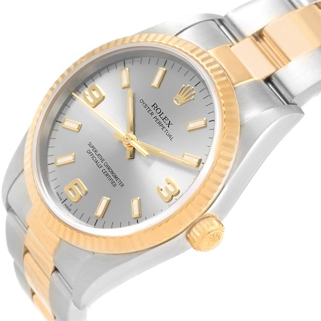 The image shows a close-up angle of the Rolex Oyster Perpetual 14233 Men's Steel and Gold (two tone) Grey Dial 14233 Men's Steel and Gold (two tone) Grey Dial watch, highlighting its dial, bezel, and part of the bracelet.