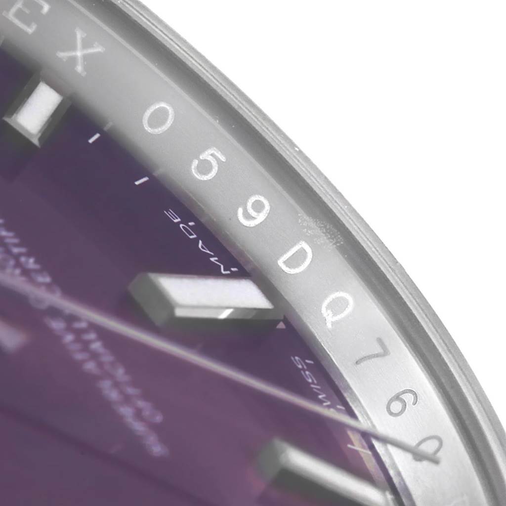This close-up image shows the dial, hour marker, and partial bezel of the Rolex Oyster Perpetual 114200 Stainless Steel Burgundy Dial 114200 Stainless Steel Burgundy Dial watch.