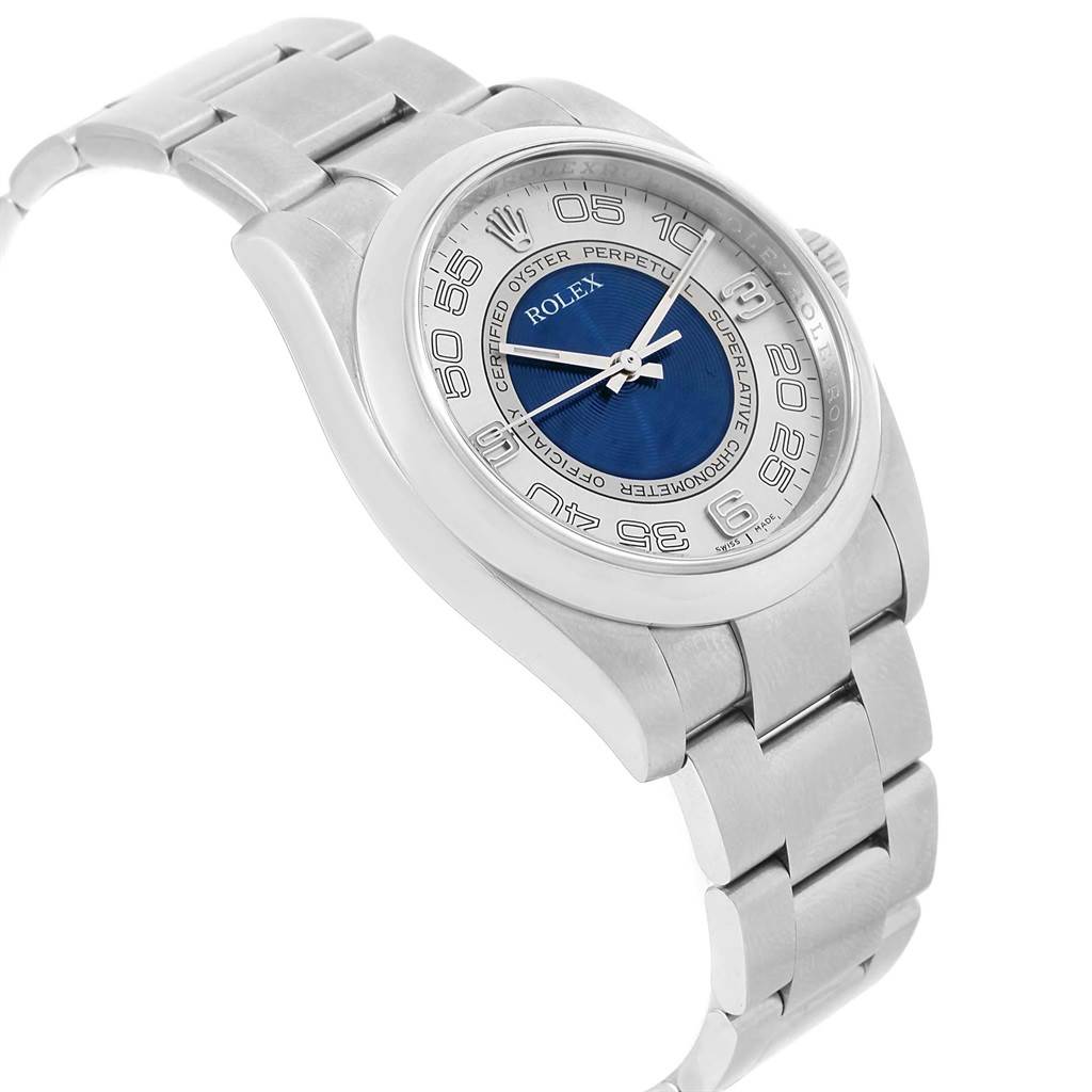 The image shows a Rolex Oyster Perpetual 116000 Men
s Stainless Steel Silver Dial 116000 Men
s Stainless Steel Silver Dial watch from an angled side perspective featuring the dial, bezel, and bracelet.