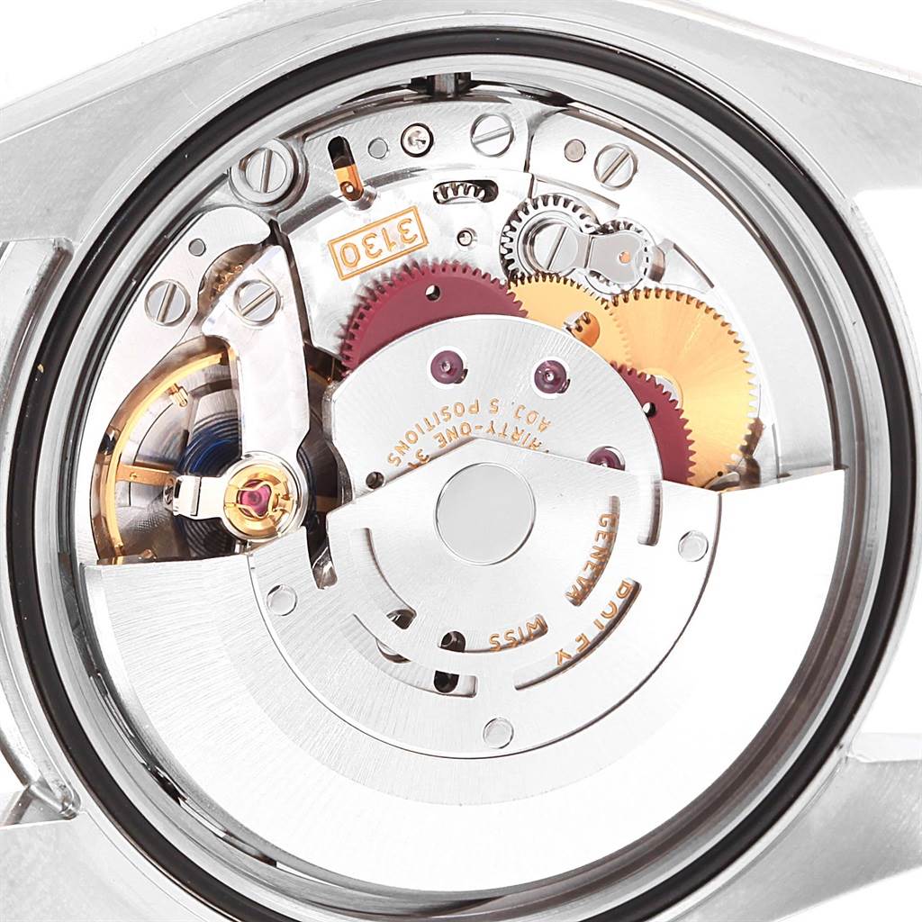 The image shows the inner mechanical movement of the Rolex Oyster Perpetual 116000 Men
s Stainless Steel Silver Dial 116000 Men
s Stainless Steel Silver Dial watch from a back angle.