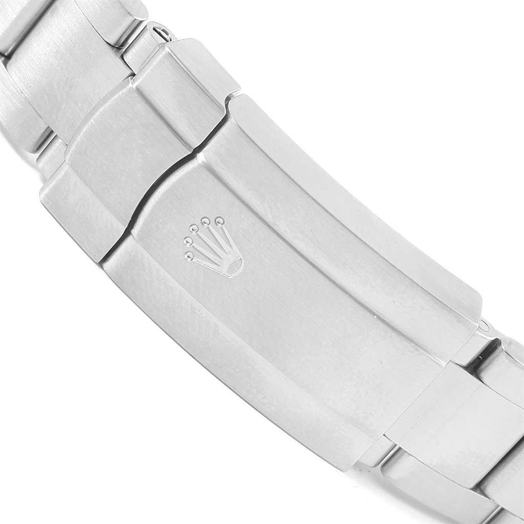 This image shows a close-up of the clasp and part of the bracelet of a Rolex Oyster Perpetual 116000 Men
s Stainless Steel Silver Dial 116000 Men
s Stainless Steel Silver Dial watch.